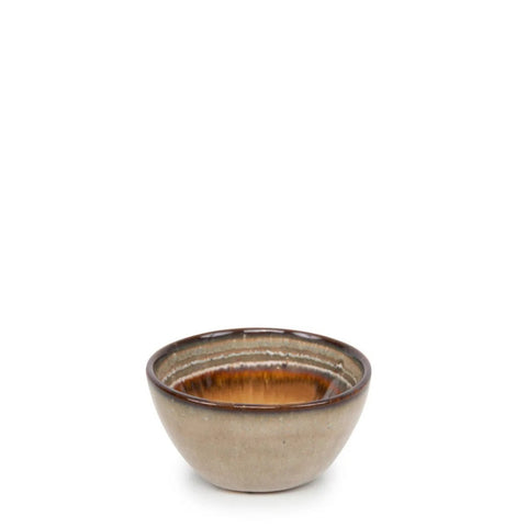 A small, round ceramic bowl with a brown and tan gradient glaze sits on a white background. The bowl, inspired by Portuguese ceramics, has a glossy finish and a simple, rustic design.