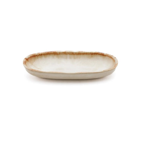 A shallow, oval ceramic plate with a slightly raised rim and a beige glaze, featuring a subtle brown edge detail, set against a white background—a beautiful piece of chip-proof handmade tableware.