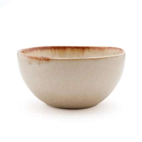 A ceramic bowl crafted from Portuguese ceramics, featuring a cream-colored exterior and a reddish-brown rim, set against a plain white background.