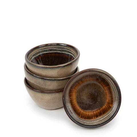 Four handmade tableware ceramic bowls with earthy brown and green tones, three stacked and one resting on its side to show the glazed interior with a radiant, circular brown pattern. Classic Portuguese ceramics set against a plain white background.