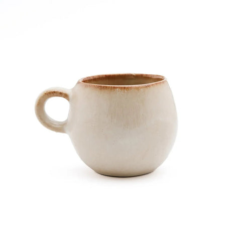 The Cascais Espresso Cup - S - Set of 6 features round, off-white ceramic mugs with small handles and slightly uneven, brown-tinted rims. Crafted from chip-proof Portuguese ceramics, each cup showcases handmade charm.