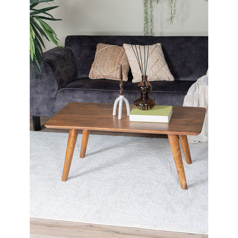 The Coffee Table James Brown 110 x 60 cm features a charming vase on top, adding warmth and style to any living room.