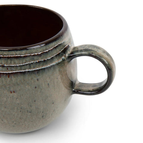 A close-up of a ceramic mug with a rounded handle, featuring a speckled gray glaze and three horizontal ridges near the rim, showcases the charm of Portuguese ceramics against a white background.