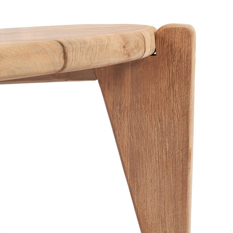 Close-up of The Seseh Coffee Table - S - Outdoor leg and corner, showcasing its natural teak wood grain, durable build, and rounded tabletop edge for a sleek, modern outdoor coffee table style.