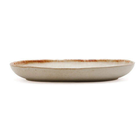 A shallow, round ceramic plate with a beige base and a slightly raised rim featuring a brownish, rustic edge design. This handmade tableware piece is photographed from the side against a white background.