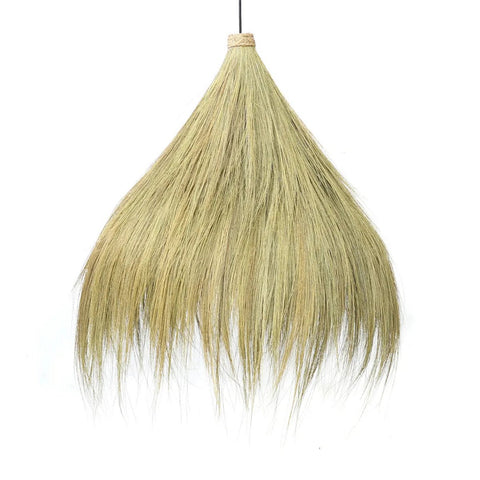 A grass broom with long, natural straw bristles fanned out, bound at the top with light-colored twine—resembling a Rayung Hut Pendant or natural pendant lighting—suspended upright against a white background.