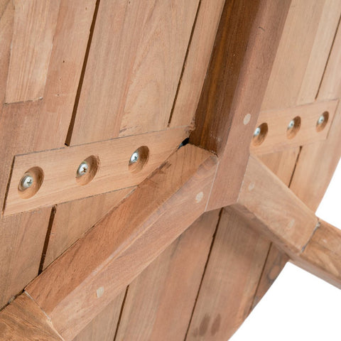 Close-up of the underside of The Seseh Coffee Table - S - Outdoor, highlighting the wood grain, support beams, and screws that secure the pieces together.