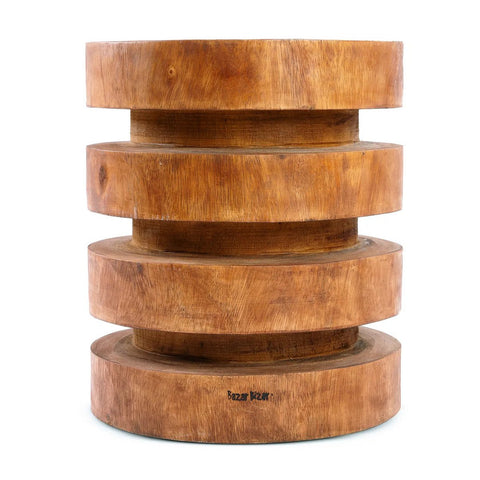 The Massaka Stool - Natural features four stacked, offset circular layers in thick suar wood. Its natural finish and visible grain create a sculptural, geometric look—an artistic addition to your natural wood furniture collection.
