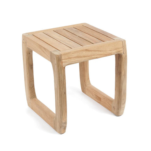 A small, square outdoor side table with a slatted top and curved, rectangular legs, all crafted from light-colored wood; this versatile stool is perfect for patios or living rooms alike.