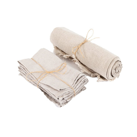 The Linen Tablecloth - Beige - 150x250: Two bundles of pure linen, one rolled and one folded with brown twine on a white background—ideal for creating your own luxurious table linens or elegant tablecloths.