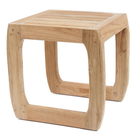 A square wooden stool with curved legs and a slatted seat, crafted from reclaimed teak wood. This versatile stool, in light-colored tones, is set against a white background.