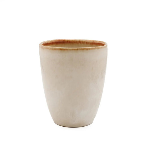 A simple, off-white ceramic cup with a slightly tapered shape—expertly crafted as part of our handmade tableware collection—features a subtle brown rim and smooth matte finish, set against a plain white background.