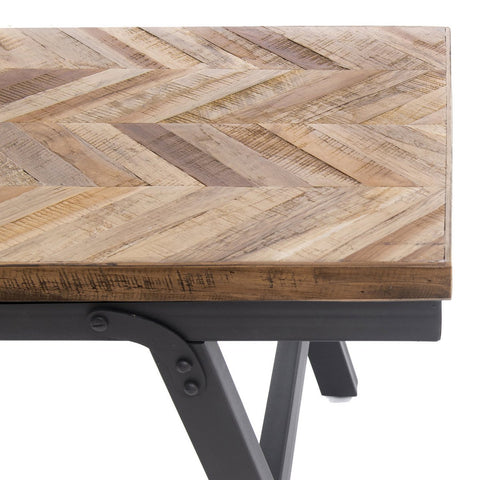 Wooden table with chevron pattern and metal legs on a white background