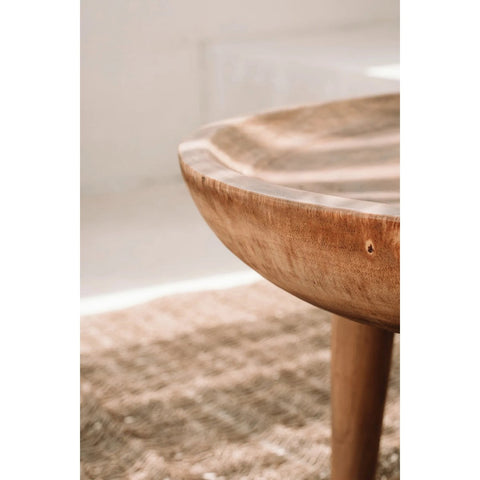 close up of a wooden side table in natural elements