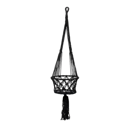 This black handmade macrame plant hanger boasts an intricate knotted design and a long woven strap. It features a round basket at the center, ideal for indoor plants, and a tassel hanging from the bottom to complete its elegant look.