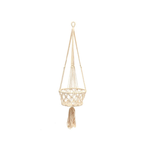 A beige macramé basket plant hanger with a woven design and a fringe tassel at the bottom is perfect for showcasing indoor plants, hanging elegantly against a white background.