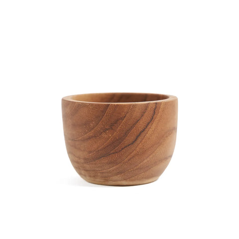 A small, round wooden bowl with smooth, natural grain patterns crafted from teak tree wood. The light-brown bowl has a simple, minimalist design and subtly echoes the charm of a Teak Root Egg Cup. It is set against a plain white background.