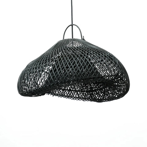 A black, woven wire pendant lamp handcrafted with an asymmetrical, organic shape hangs from a single cord against a white background. Resembling a delicate mesh structure, this boho lamp adds a touch of artistic elegance to any space.