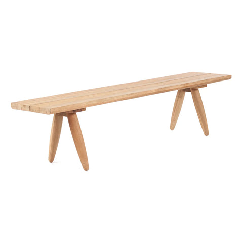 A minimalist wooden bench crafted from upcycled teak wood features a long, rectangular seat and four angled legs. The light, natural finish highlights its grain, making it an eco-friendly statement design piece with a simple and contemporary flair.