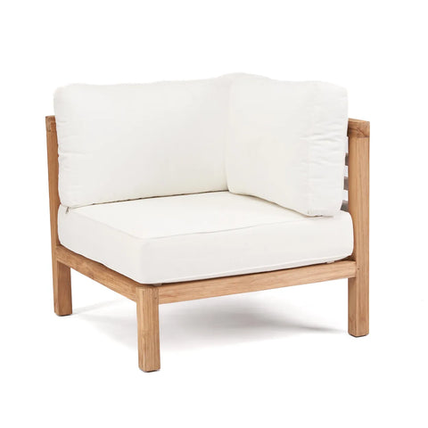 This wooden-framed corner chair with white cushions uses reclaimed teak wood, adding an eco-friendly touch to its minimalist design. Thick, plush padding on the seat and back enhances its comfort, making it perfect for stylish outdoor seating.