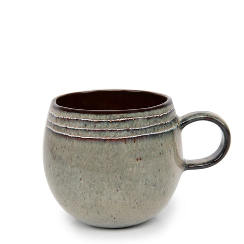 A round, grey ceramic mug with a speckled texture and a single handle showcases its unique design, featuring three decorative lines near the rim. This piece of tableware is set against a plain white background, reminiscent of Portuguese ceramics.