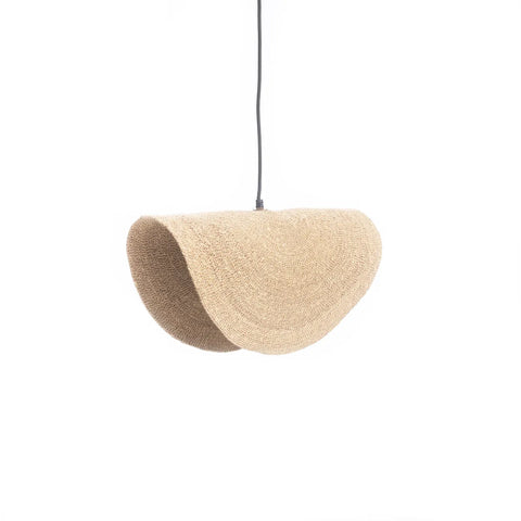 A unique woven grass pendant lamp with an organic, curved shape hangs from a black cord. Its natural texture and beige color offer an earthy appearance, blending modern design with rustic elements. The white background highlights this cosy interior lighting piece perfectly.