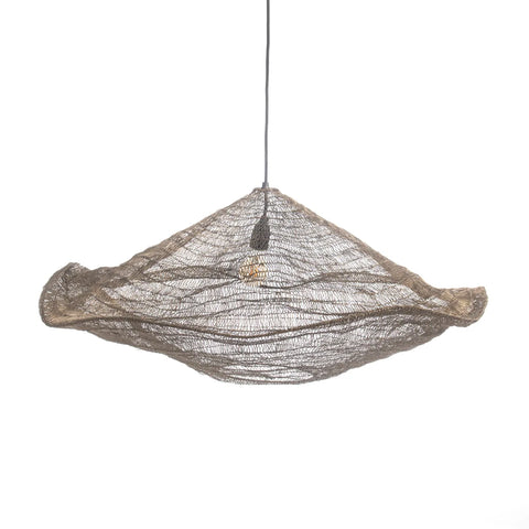 A pendant light with a unique wire mesh design resembling a layered, abstract cloud. Handcrafted with an iron finish and suspended from a thin black cord, it boasts a brass shine that allows the bulb to glow warmly through the woven texture.