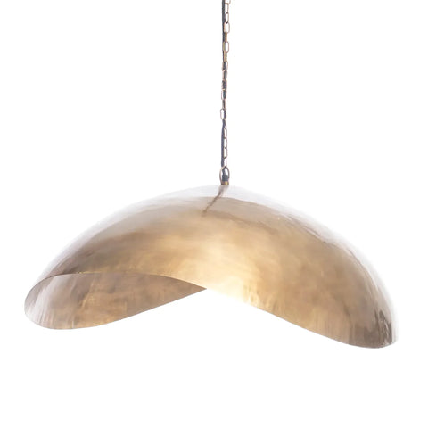 A modern, dome-shaped pendant light fixture with a brass finish, hanging from a chain. This Fortune Cookie pendant features a smooth, curved design with overlapping edges, creating an elegant and contemporary look.