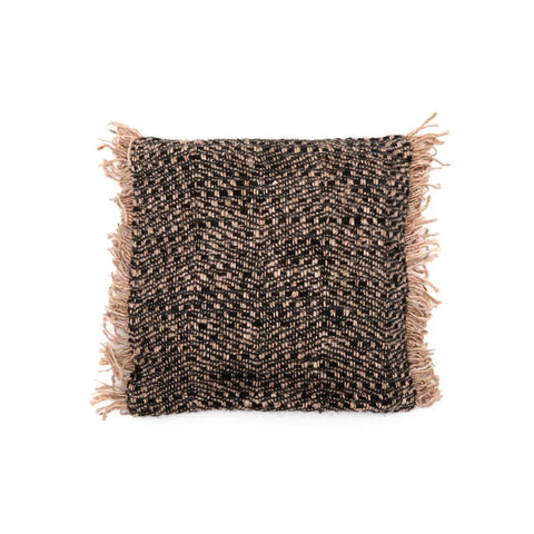 A square cotton cushion with a textured black and beige woven pattern features fringed edges on all four sides, adding a decorative touch. This boho cushion design provides a rustic and cozy appearance.