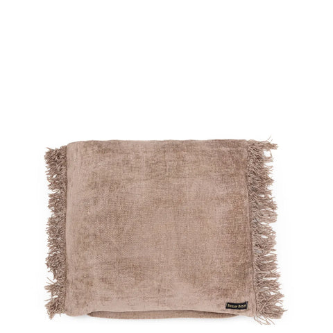 A folded beige throw blanket with fringed edges exudes a boho vibe. Made of soft, textured fabric, this unique textile product features a small sewn tag in the corner, adding a touch of charm.