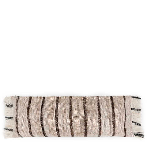 A rectangular decorative pillow exuding a boho vibe, crafted from beige cotton with dark brown vertical stripes. This handmade textile piece features fringed edges on both short sides.