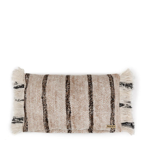 This cotton cushion boasts a bohemian white vibe, showcasing horizontal black and brown stripes on a cream background. The pillow is adorned with fringe detailing on each shorter end, perfect for adding a touch of boho charm to any space.