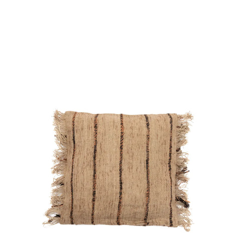 A square, textured cotton cushion in beige, featuring black vertical stripes and frayed edges, exudes a boho charm. Skillfully hand-dyed, the cushion is set against a plain white background.