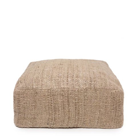 A square, beige burlap pouf with a textured surface, hand-dyed to perfection, is shown against a plain white background. This stylish home accessory effortlessly enhances any space.