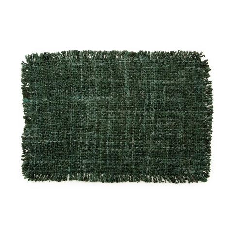 A hand-dyed rectangular green textured rug with a fringed border on all sides, lying flat against a white background, exuding a luxurious texture.