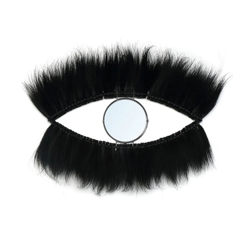 This black grass mirror, a stunning wall decoration, is designed to resemble an eye with its fluffy eyelashes forming an elegant shape against a white background. Its unique design adds a touch of boho chic style to any space, making it a captivating focal point.