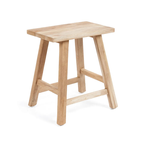 The Oriki Stool, crafted from reclaimed teak wood, boasts a rectangular seat and four sturdy legs with a natural, unfinished look. This versatile piece can seamlessly double as a side table, all set against a plain white background.