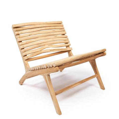 A handmade teakwood lounge chair with a slatted design, featuring a natural, unfinished look. The chair has a low seat and slightly reclined backrest, showcasing a simple yet unique design. It’s set against a plain white background, embodying modern elegance.