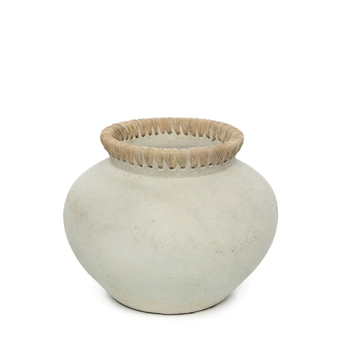 A round, off-white ceramic vase with a wide, woven raffia detail evoking coastal vibes, displayed against a plain white background.