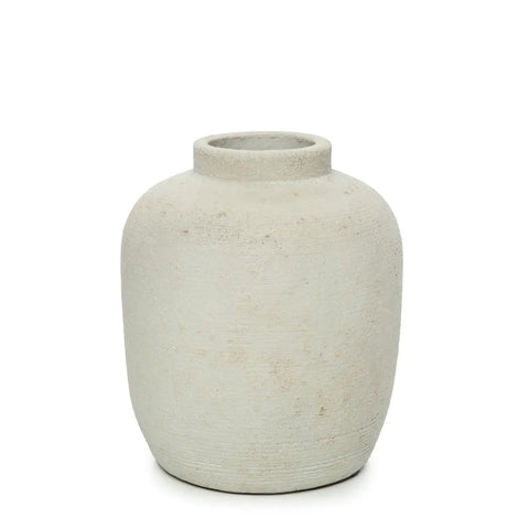 A simple, rustic off-white ceramic vase with a rounded body and ribbed texture, featuring a narrow opening, set against a plain white background.