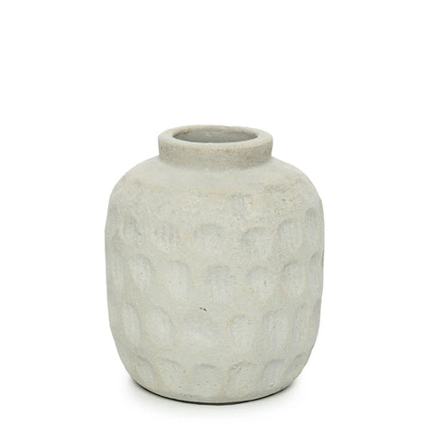 A textured, light gray ceramic vase with a rounded body and small opening, featuring a subtle ribbed texture and dimpled pattern across its surface, perfect for showcasing dried flowers.