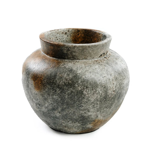 An ancient, weathered Terracotta vase with a wide, round body and a narrow, slightly chipped rim. The surface has a rough texture and varied shades of antique grey, suggesting age and history, perfect for showcasing dry flowers.