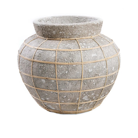 A large, spherical cement vase with a textured surface and rattan detail, creating a grid-like pattern. The wide, flat rim complements its rustic, earthy appearance, making it perfect for displaying dry flowers.