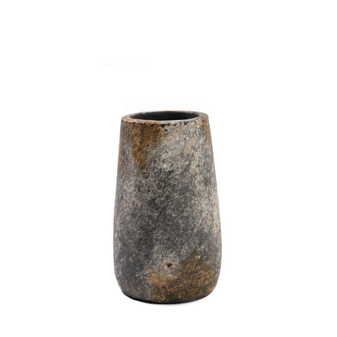 A tall, stone-textured vase with a weathered, rustic appearance boasts an antique grey hue and resembles terracotta. It features a natural blend of gray and brown tones, creating an earthy, aged look. Perfect for showcasing dry flowers, its plain design is free of visible decorations or patterns.