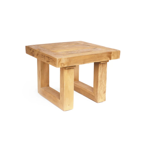 A square side table crafted from reclaimed teak wood with a natural finish, featuring thick square legs connected at the base. The table boasts a simple, rustic design and is a perfect piece of sustainable furniture, all presented on a white background.