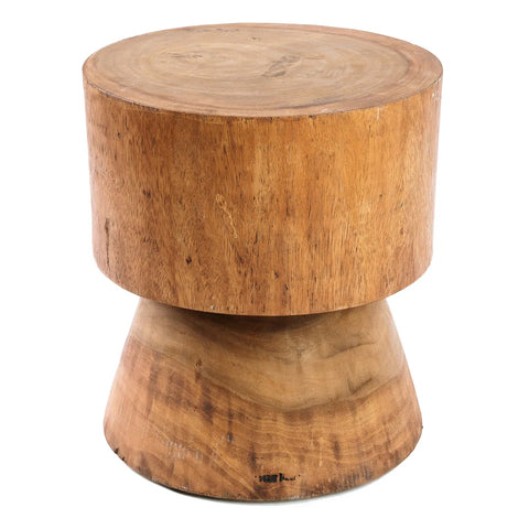 The Mitcha stool features a smooth, cylindrical top and a wider, tapered base crafted from suar wood. With its natural, warm finish that highlights exquisite grain patterns, this piece embodies minimalist design.