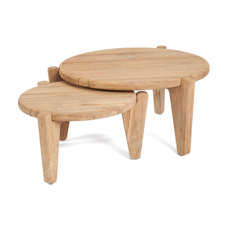 Two round Seseh Coffee Tables feature simple, unique designs with sturdy legs. Crafted from reclaimed teak wood, the smaller table nestles under the larger one, creating a charming nested arrangement. The light finish beautifully highlights the wood's natural grain.