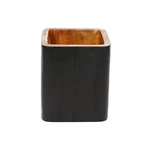 A multifunctional rectangular black wooden pen holder with a visible natural wood interior, standing upright against a plain white backdrop, makes the perfect interior accessory.