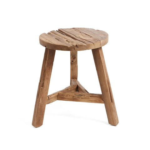 A rustic Yatai stool featuring three legs and a round, rough-hewn seat. Crafted from reclaimed teak wood, its weathered appearance enhances its vintage charm.