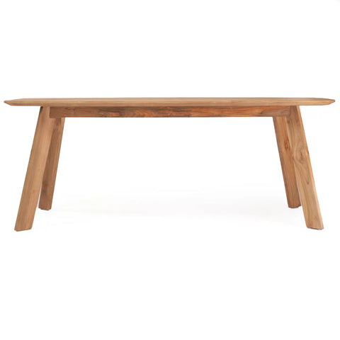 An eco-friendly wooden dining table with a rectangular top and angled legs, showcasing a natural wood finish. Crafted from upcycled teak wood, the table has a sleek, minimalist design, perfect for a modern interior.